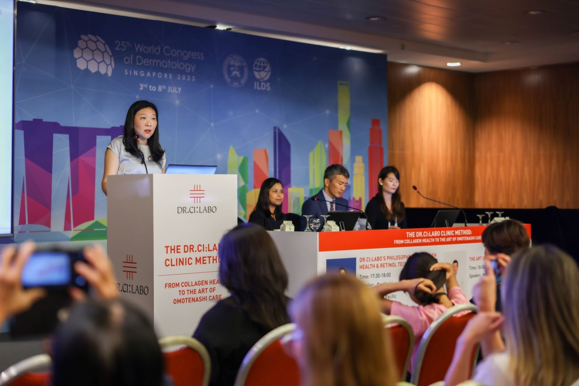 Panel of speakers at the Dr.Ci:Labo scientific symposium, WCD 2023